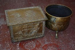 A brass coal bucket on claw feet and brass clad coal box.