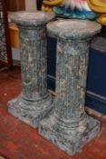 A pair of scagliola fluted columns on pedestals108cm high