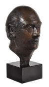 English 20th Century school, a patinated bronze portrait bust of a gentleman, reputedly H.W.O.