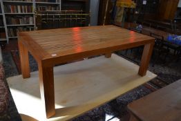 A modern hardwood coffee table inset with bamboo