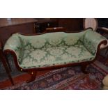 An early Victorian lyre shaped sofa in green damask covers.