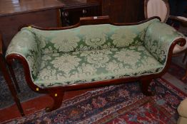 An early Victorian lyre shaped sofa in green damask covers.