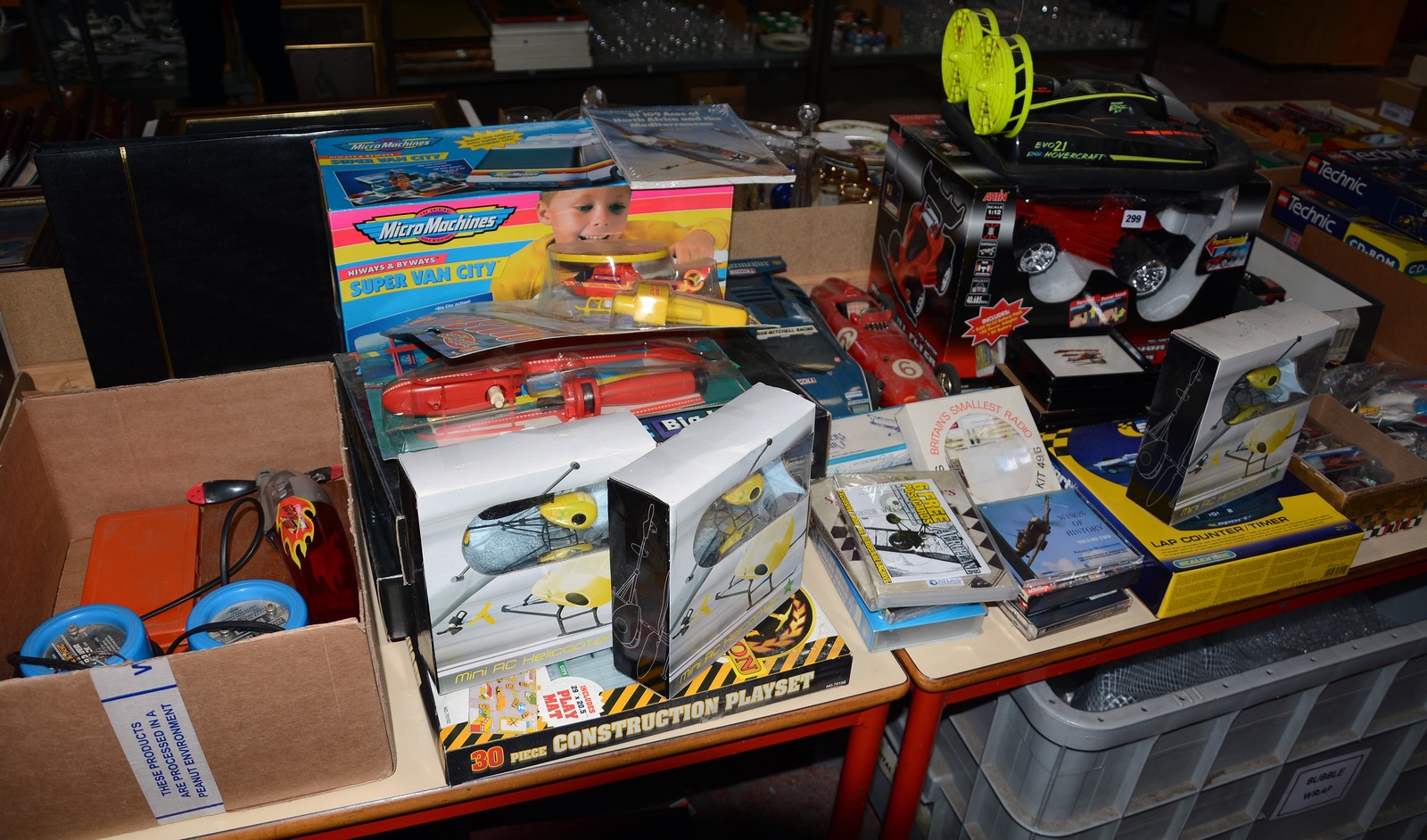 A quantity of die cast cars, boxed radio controlled car, Mini RC Helicopters, a hover craft etc. (as