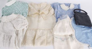 A collection of early to mid 20th century children's costume, comprising: silk dresses for babies