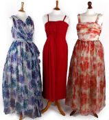 Five 1950s evening dresses, comprising: a Mandell Couture of London blue and mauve dress; a cream
