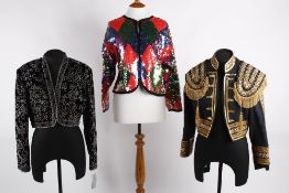 A collection of eight ladies jackets, comprising: a black velvet evening jacket with bead