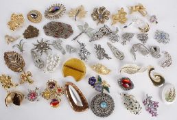 A quantity of costume jewellery, comprising: marcasite and paste 1930s dress clips and assorted
