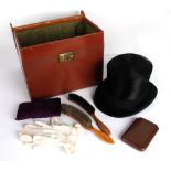 A Joshua Turner black silk top hat, 55cm circumference, with a fitted leather case; a leather collar