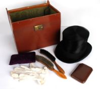 A Joshua Turner black silk top hat, 55cm circumference, with a fitted leather case; a leather collar