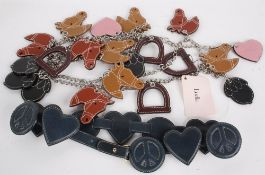 A Luella designer leather and chain belt with horses, hearts, stirrups and acorn motif; together
