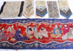 A mixed lot of Oriental textiles and robe pieces, including: embroidered sleeve bands, edgings,