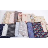 A collection of textiles and dressmaking fabrics, including: Liberty florals, 1960s seersucker
