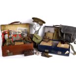 A quantity of Wartime collectables contained within three suitcases, including: a field telephone in