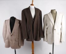 A quantity of vintage menswear, including: shirts, jackets, knitwear and trousers.. Best Bid