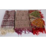 A 19th century fine silk shawl with a fringe; a wool shawl with red fringing; and a printed shawl (