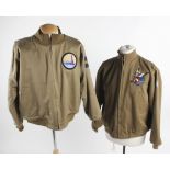 An American khaki bomber jacket, dated 1942; together with a pair of green military issue