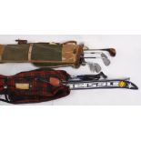 A set of vintage golf clubs within a canvas bag, labelled 'A Douglas Product, Made in England';