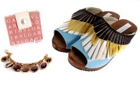 A pair of Ann-Louise Roswald fringed leather and wood clogs; a Bulgari pink and cream canvas and