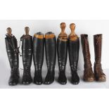 Two pairs of black leather riding boots and trees; a pair of black leather lace-up boots (possibly