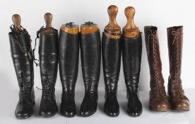 Two pairs of black leather riding boots and trees; a pair of black leather lace-up boots (possibly