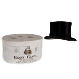 A black silk top hat by Henry Heath, in the original box dated 1936, 57cm circumference.