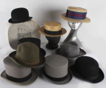 Two vintage bowler hats; together with two straw boaters, two grey top hats, a black top hat and two