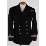 A suitcase containing vintage uniforms, including: a Naval uniform, five shirts, two pairs of