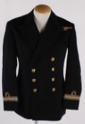 A suitcase containing vintage uniforms, including: a Naval uniform, five shirts, two pairs of