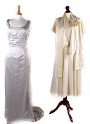 A 1930s ivory satin wedding dress; together with a mid 20th century wedding dress; and a 1980s cream