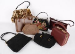 A black suede Waldybag; together with a brown corde 1950s handbag; a 1940s bag by Mac; a carpet