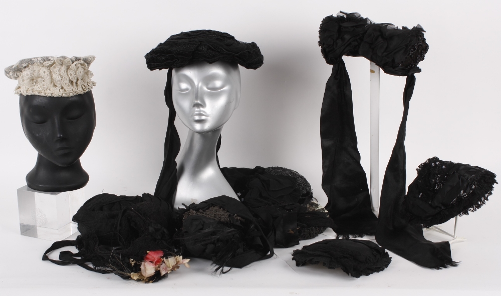 A collection of 19th century Victorian bonnets, including: a black straw and velvet bonnet; a