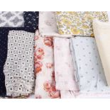 A quantity of dressmaking fabric, including: red and white checked cotton, yellow voile with lace