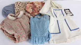 A collection of children's clothing, including: a Liberty silk floral dress with matching