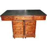 An Edwardian mahogany pedestal desk; together with a set of small wooden stepladders, used for