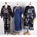 An early 20th century Chinese midnight blue silk robe, satin stitch embroidered roundels designed