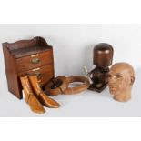 A male shop mannequin head; together with a set of small oak storage drawers; a wooden adjustable