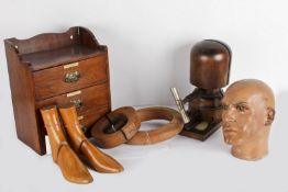 A male shop mannequin head; together with a set of small oak storage drawers; a wooden adjustable