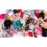 A collection of 1960s and 1970s silk and fabric corsage and millinery flowers, including: roses,