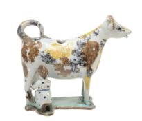 An English pearlware Pratt-type cow-creamer with attendant milk-maid  An English pearlware Pratt-