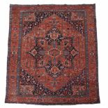 A Serapi carpet , decorated throughout with abstract foliate motifs  A Serapi carpet  , decorated