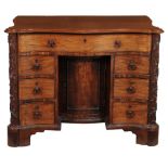 A George III mahogany serpentine kneehole desk, circa 1760  A George III mahogany serpentine