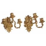 A pair of Continental gilt bronze three light wall appliques  A pair of Continental gilt bronze