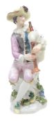 A Meissen model of Harlequin playing the bagpipes, mid 18th century  A Meissen model of Harlequin