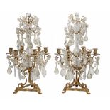 A pair of French moulded and cut glass and gilt metal mounted six light... A pair of French