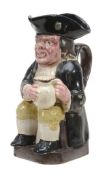 An English pearlware Toby jug of so-called 'collier' type, circa 1800  An English pearlware Toby jug