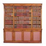 A companion pair of Victorian satinwood and marquetry library bookcases A companion pair of