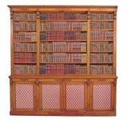 A companion pair of Victorian satinwood and marquetry library bookcases A companion pair of