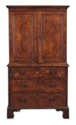 A George II burr walnut and featherbanded secretaire cabinet on chest  A George II burr walnut and