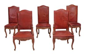 A set of ten oak and leather upholsered chairs in Louis XV style  A set of ten oak and leather