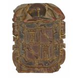 A Spanish carved, painted and parcel gilt walnut armorial panel  A Spanish carved, painted and